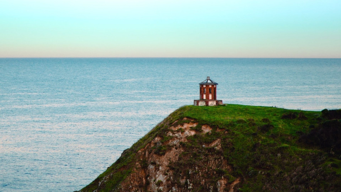 Lighthouse Over A Cliff